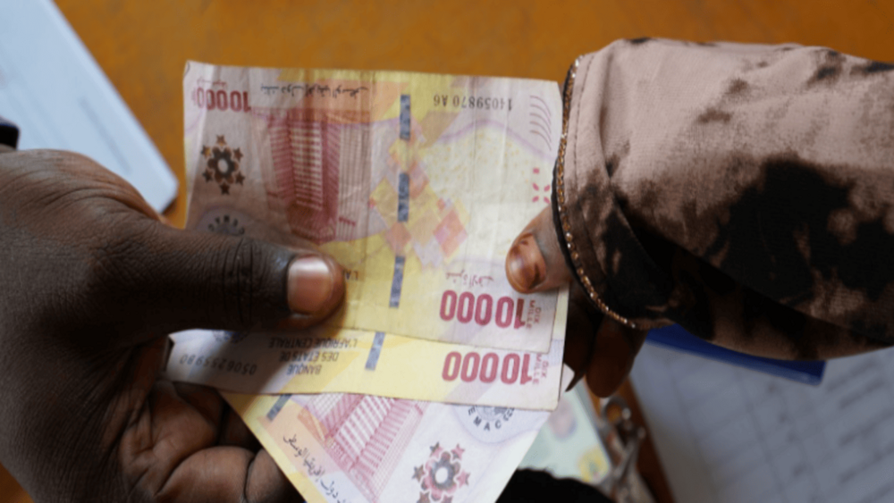 ​​​​A beneficiary receiving the cash